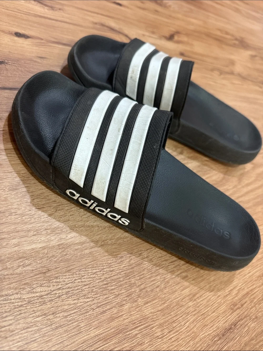 Men’s size 11 adidas Black Slides with White Three-Stripes